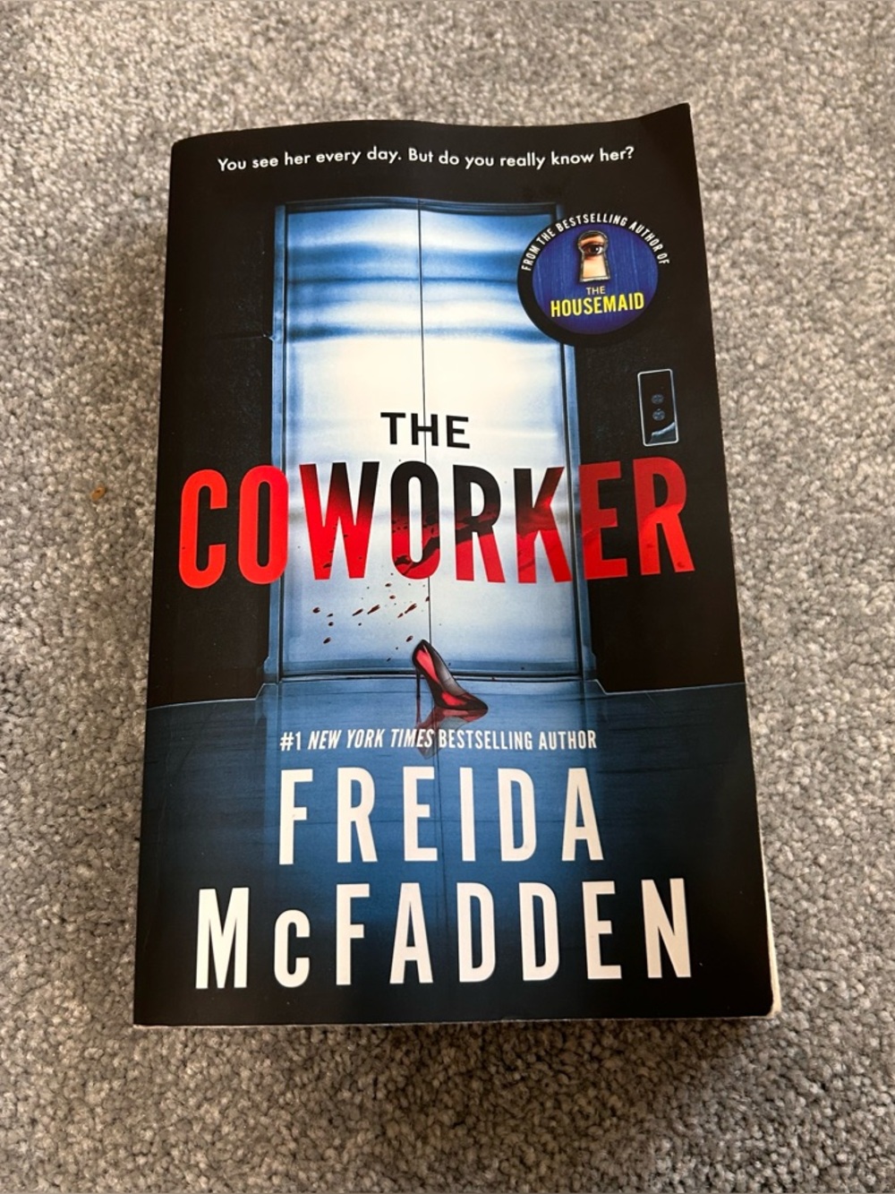 The Coworker by Freida McFadden - Paperback Thriller, Blue & Black Cover